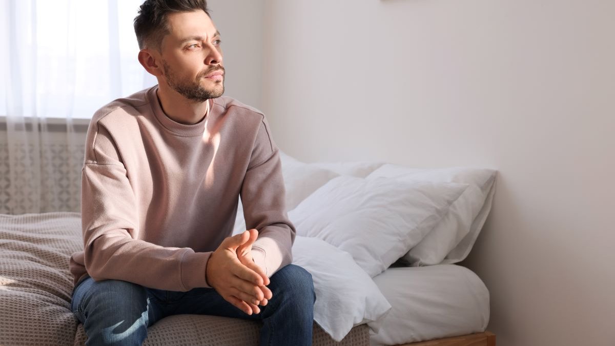 man-thinking-at-home