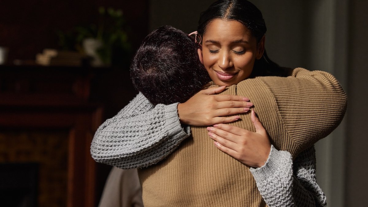 gratitude thankful woman smile happy hug embrace