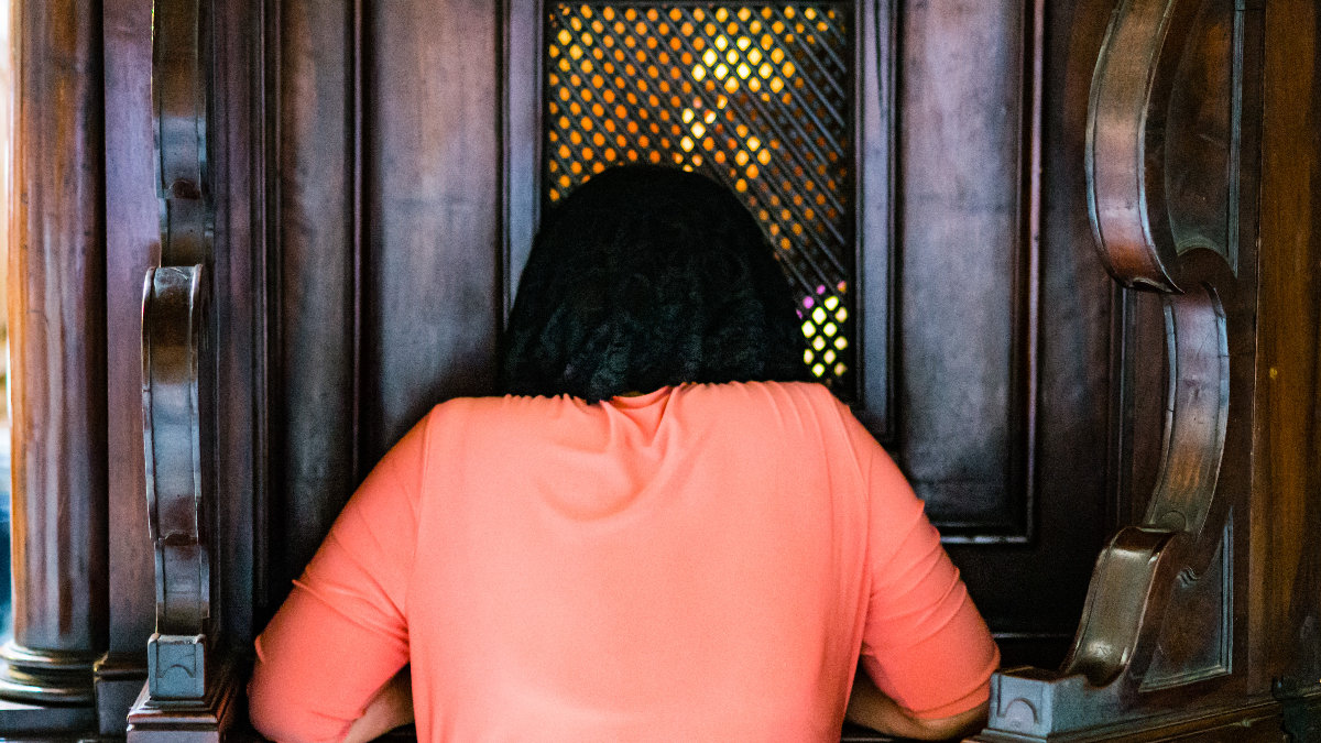 woman-confession-kneel-Catholic-