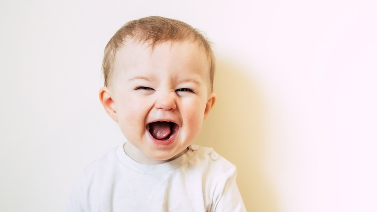 Baby with flu laughing