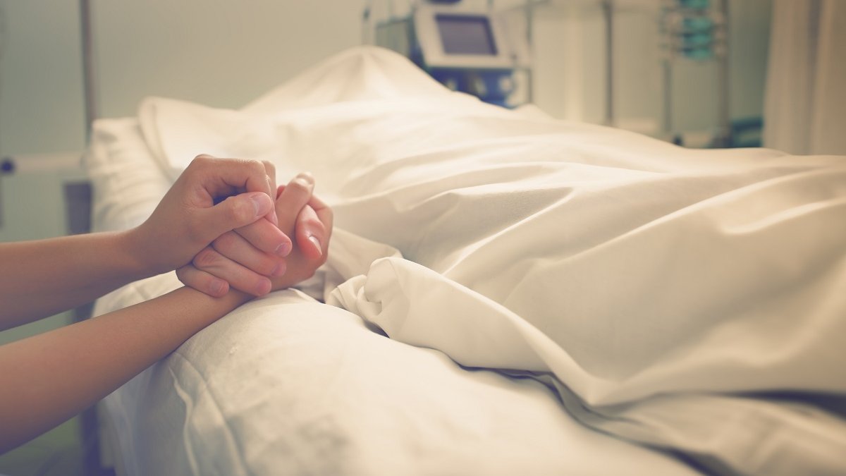 hands mourning dead loved one