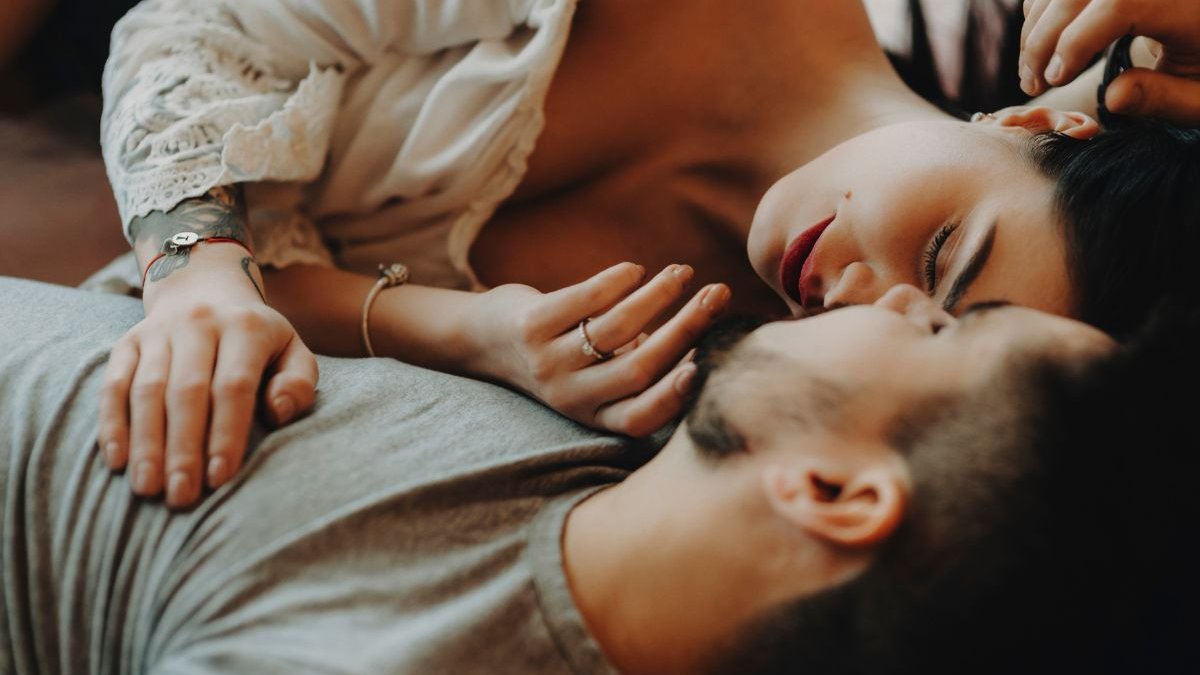 Couple hugging in bedroom