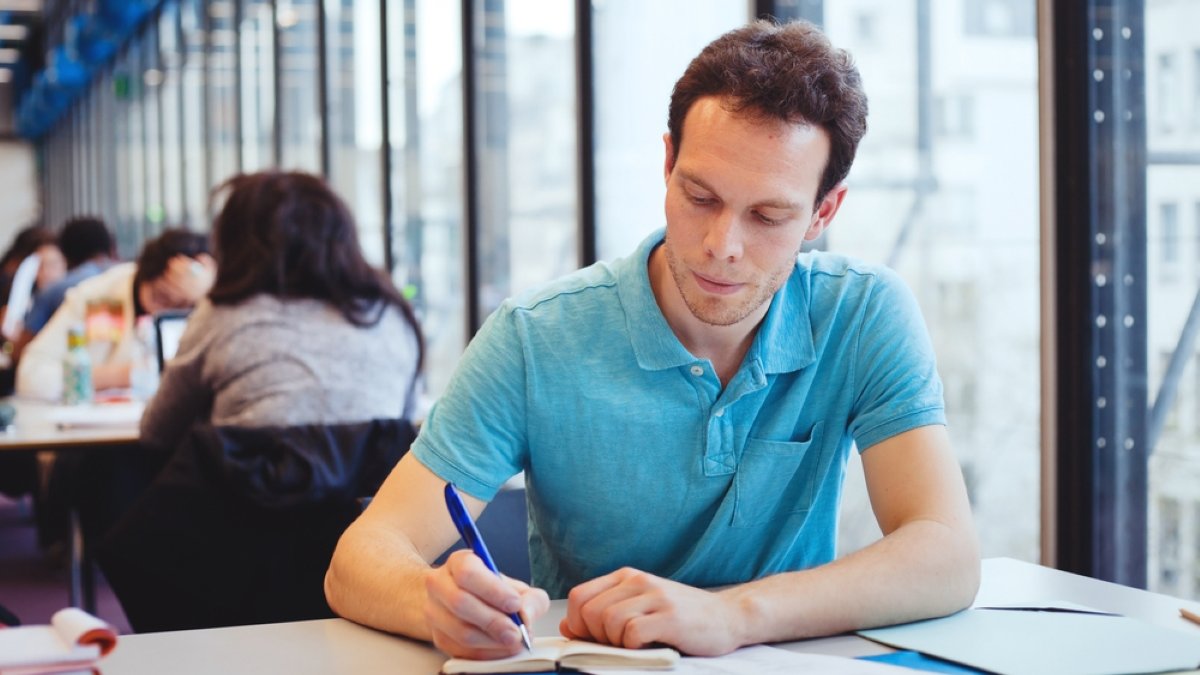 student working in the library