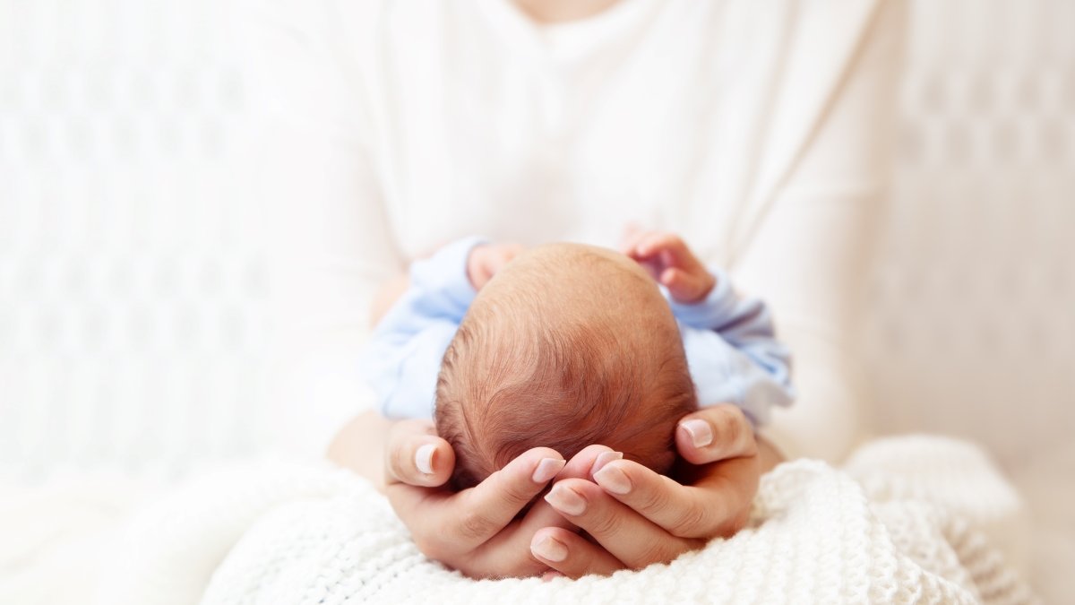 Baby Head in Mother Hands