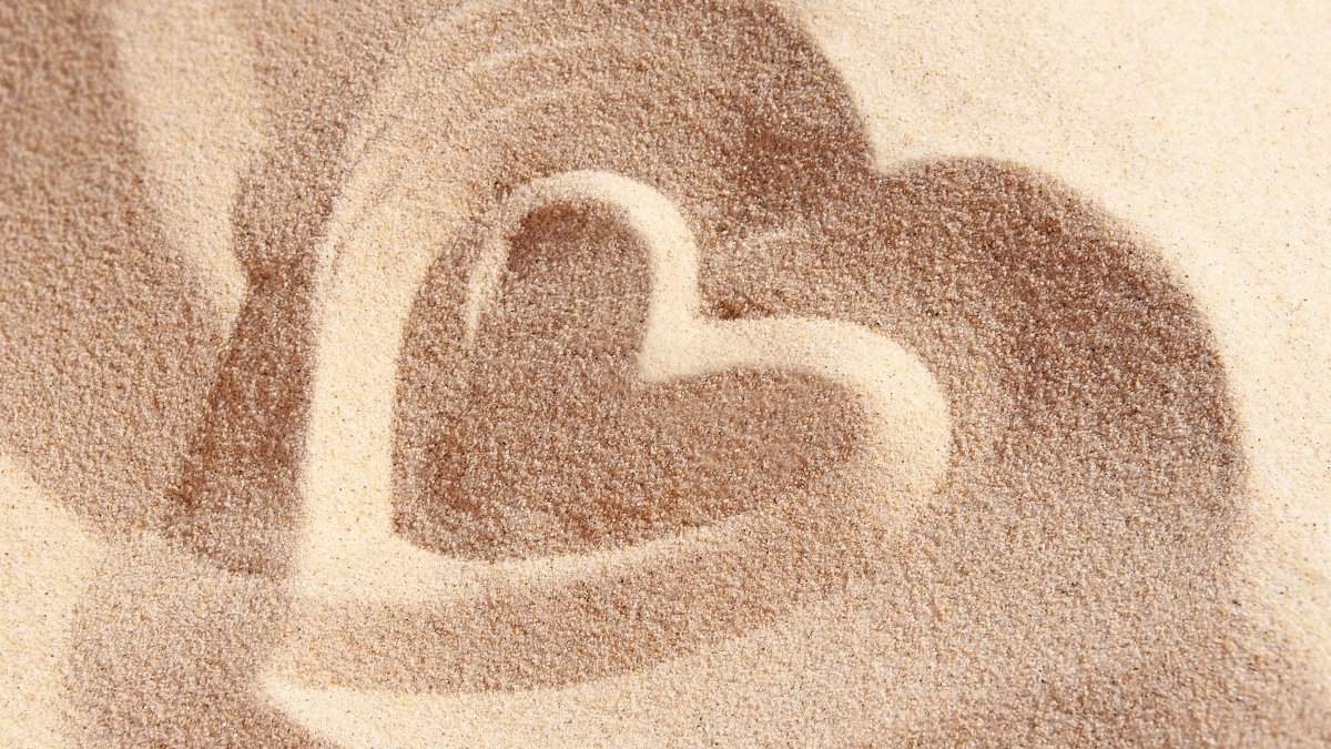 Heart drawn on sand