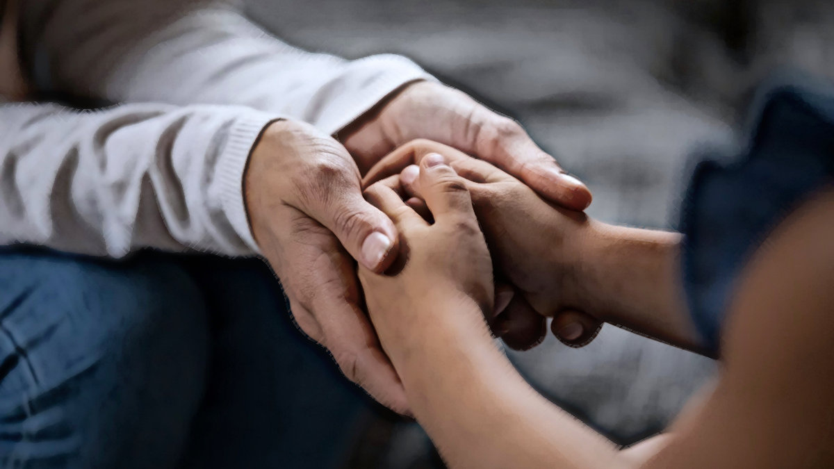 Dad holding child's hand
