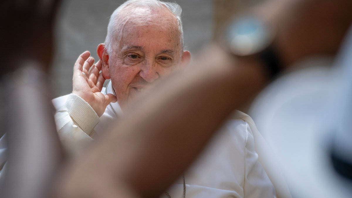 A gust of wind lifts Pope Francis' skullcap at the end of his weekly general audience in St. Peter's square at the Vatican on May 15, 2024