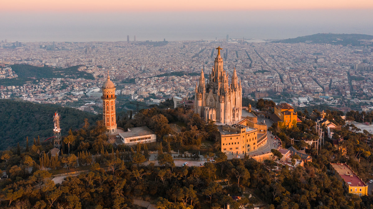 Aerial-view-of-Barcelona-skyline-with-Sagrat-Cor-temple-during-sunset-Catalonia-Spain.jpeg