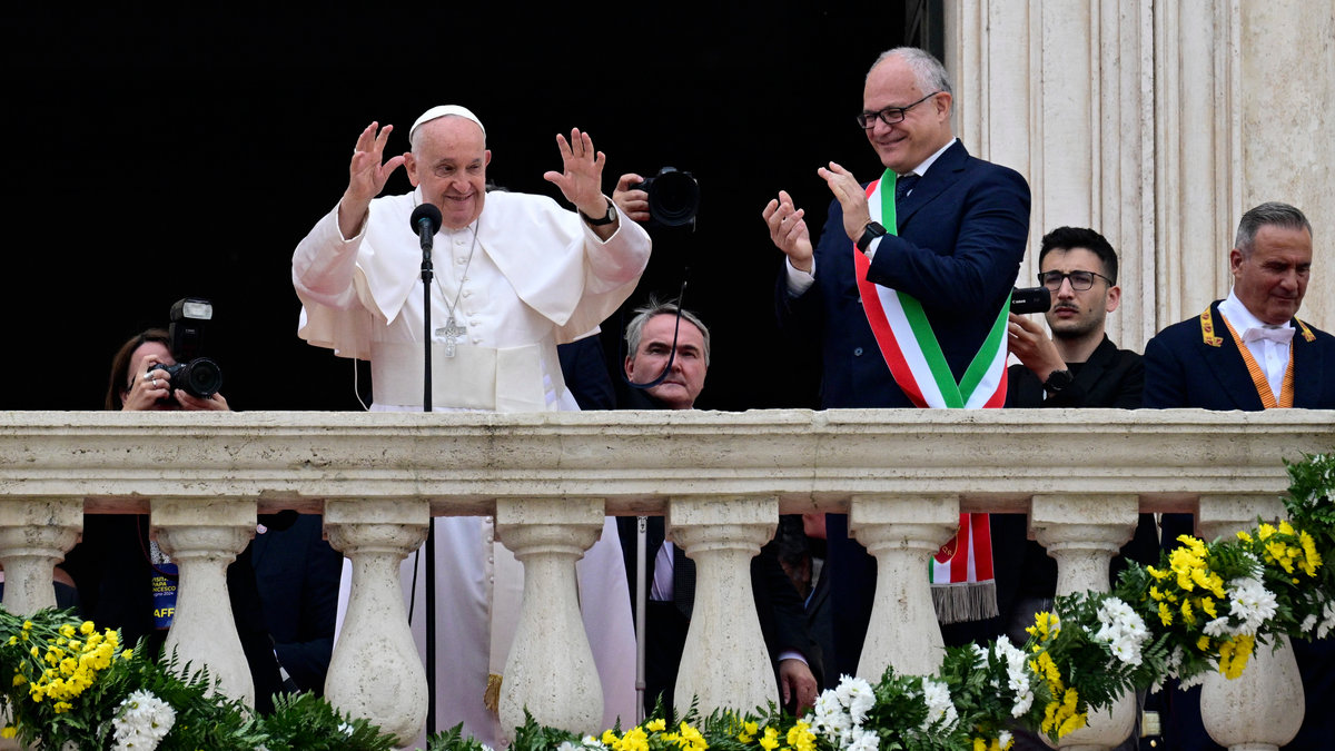 Pope Francis waves next to the mayor of Rome Roberto Gualtieri during a visit at Rome's City Hall on June 10, 2024.