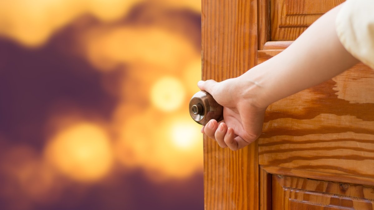 Women hand open door knob or opening the door
