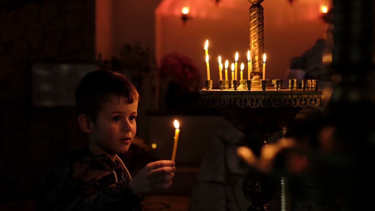 Orthodox-boy-lights-candle.jpg