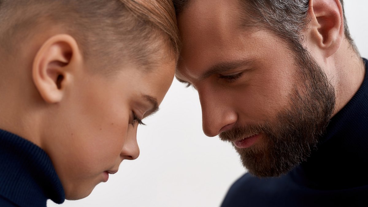 Dad son forehead touching