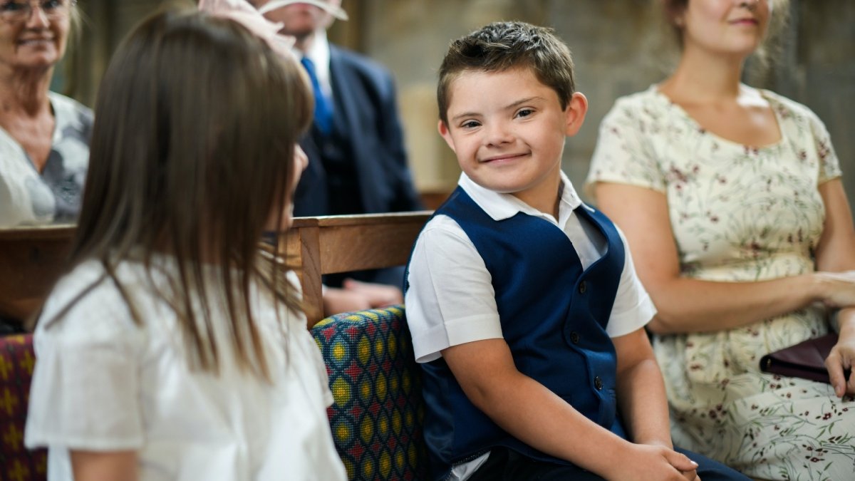 Down syndrome boy in a church