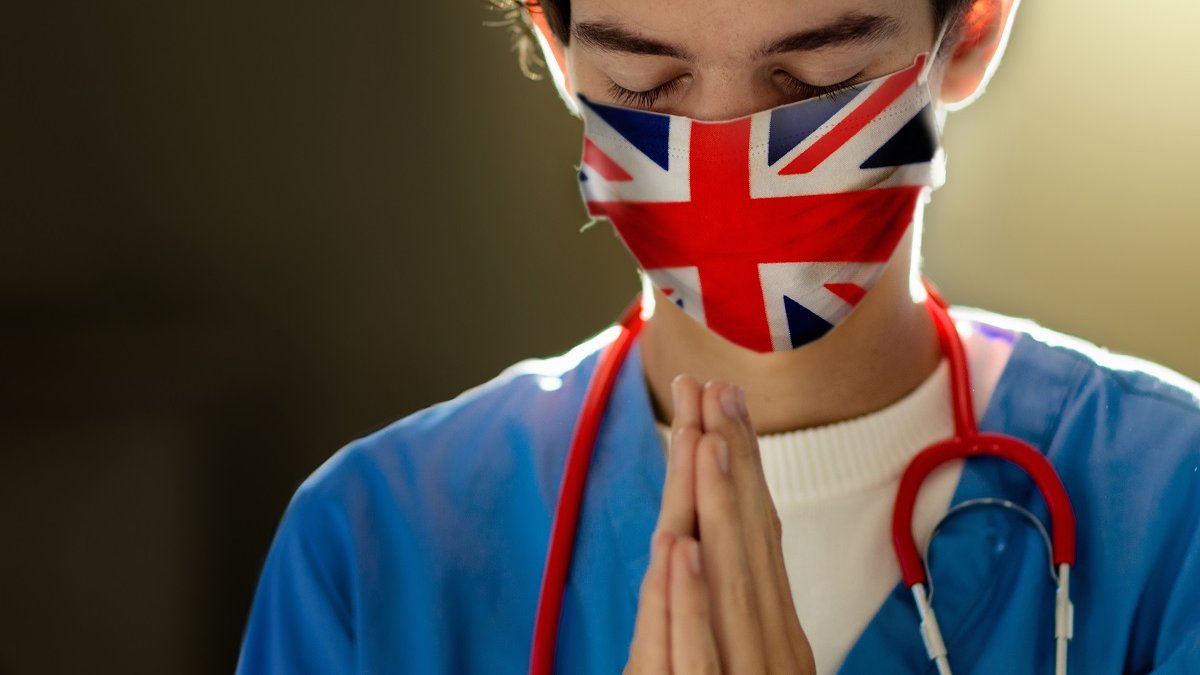 English doctor prayer hands