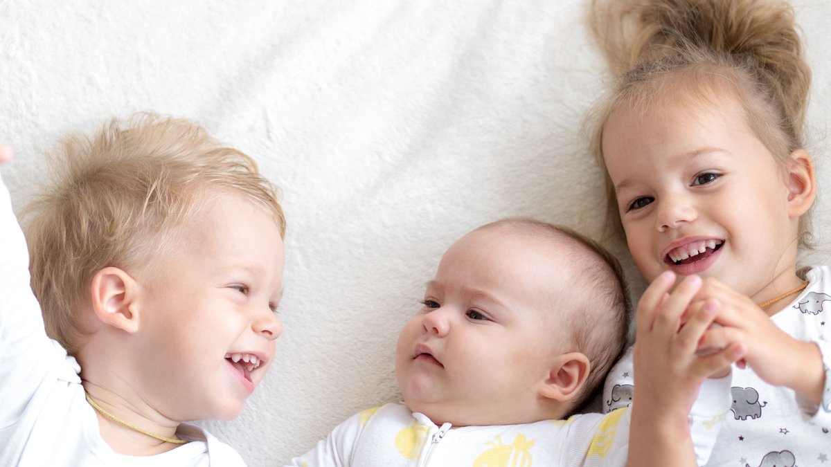 Baby with older siblings