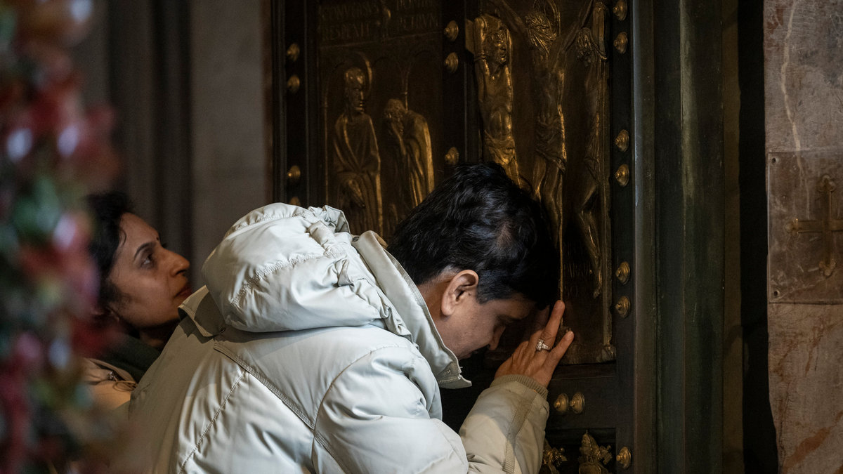 Groups of pilgrims enter St Peter's Basilica through the Holy Door a day after Pope Francis opened it for the start of the Catholic Jubilee Year 2025, in the Vatican on December 25, 2024.