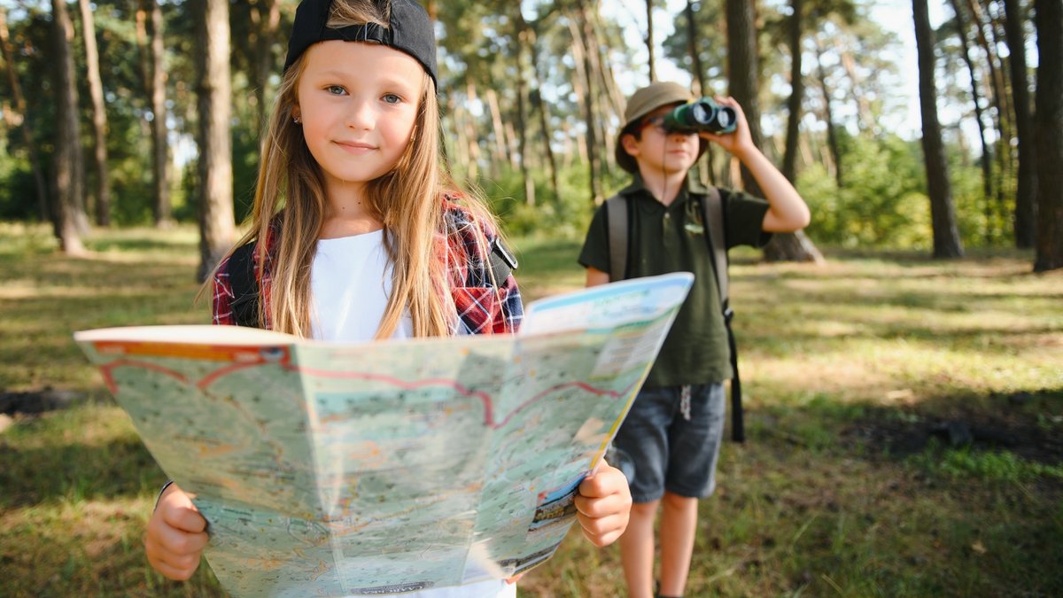 girl with map and boy with binoculars