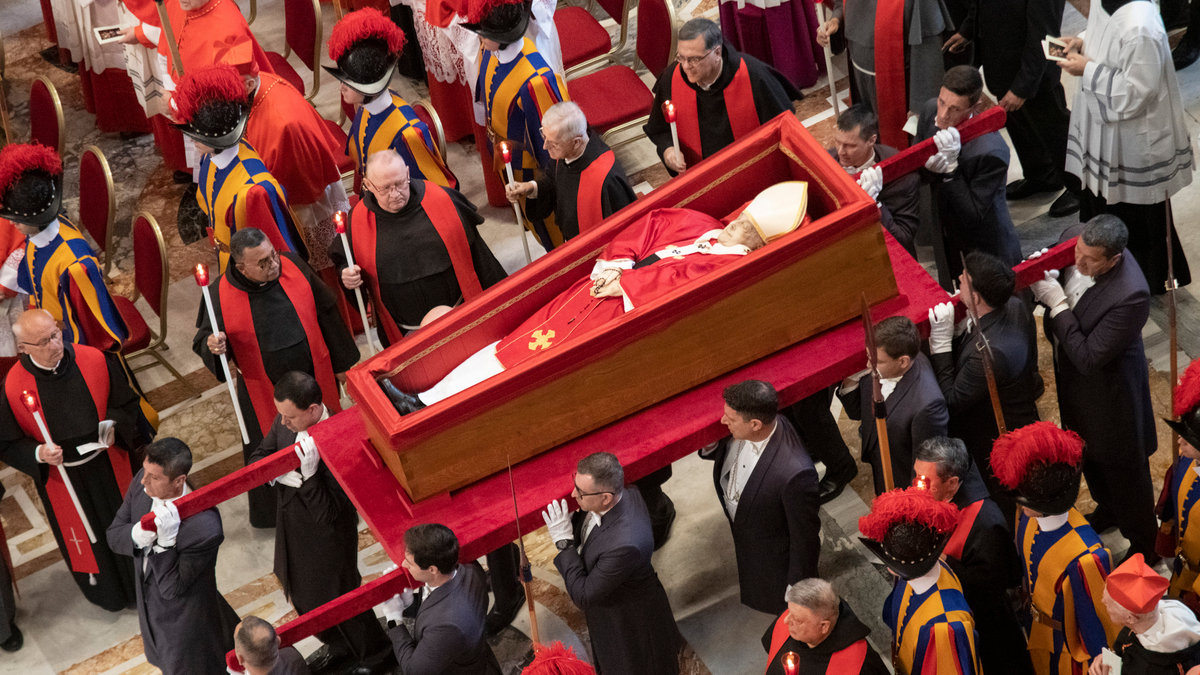 Pallbearers carry the coffin of the late Pope Francis inside St Peter's Basilica as it is transported in a procession from the chapel of Santa Marta to St Peter's Basilica, following the Pope's death, in the Vatican on April 23, 2025.