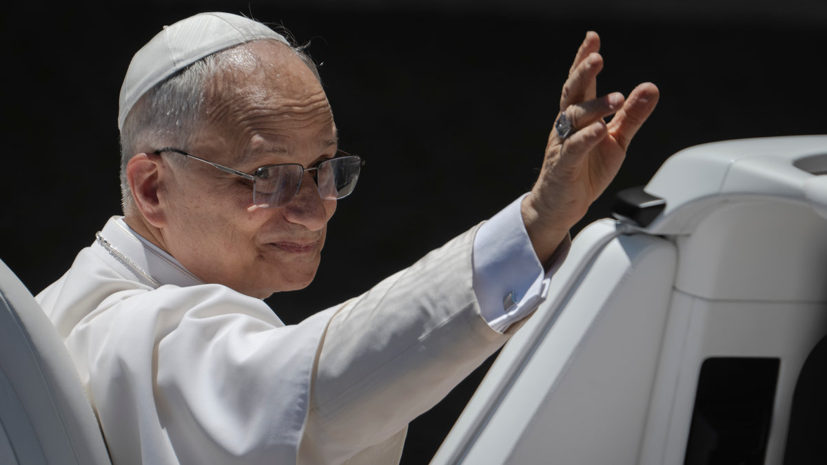Pope Leo XIV waves to the crowd as he leaves on a popemobile after the weekly general audience at St Peter's Square at The Vatican, on May 28, 2025