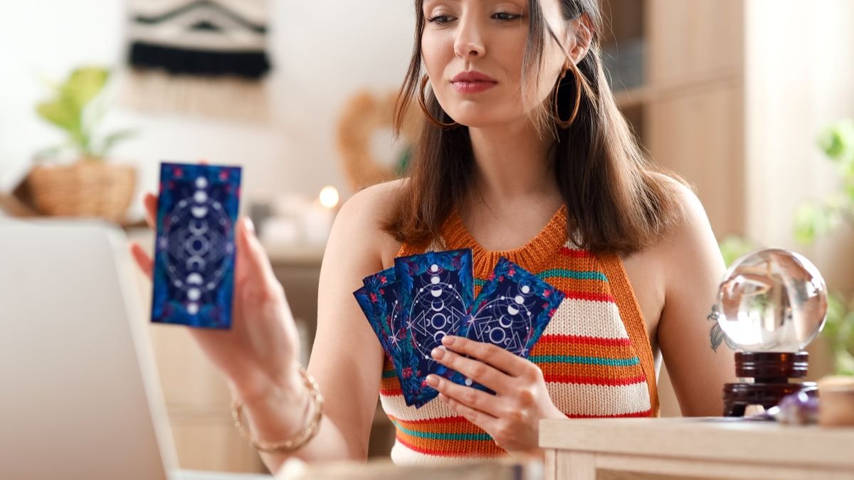 girl playing with tarot cards
