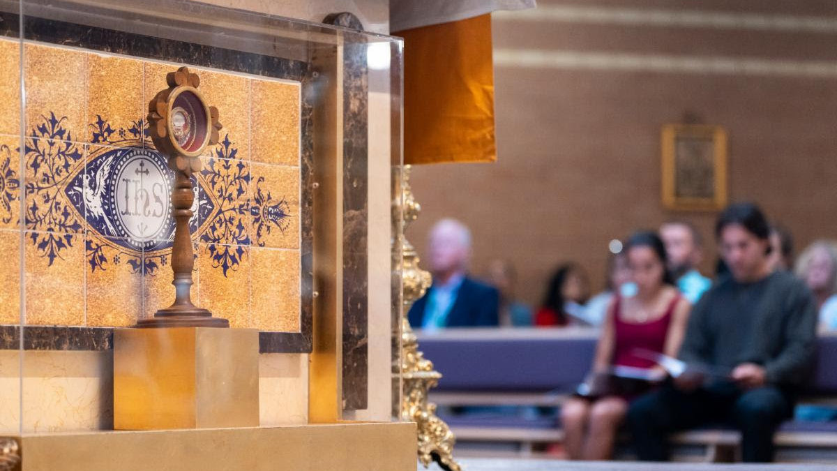 People praying by a relic