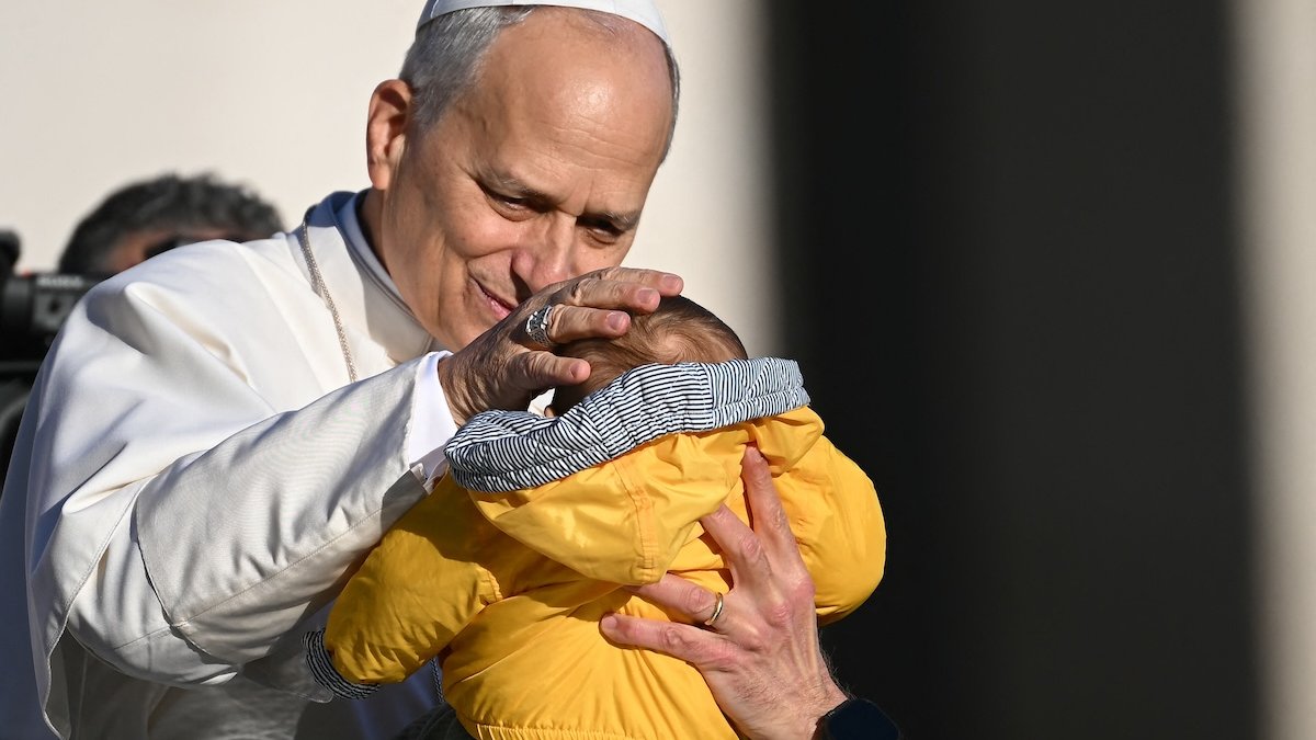 leo-blesses-small-child-in-yellow.jpg