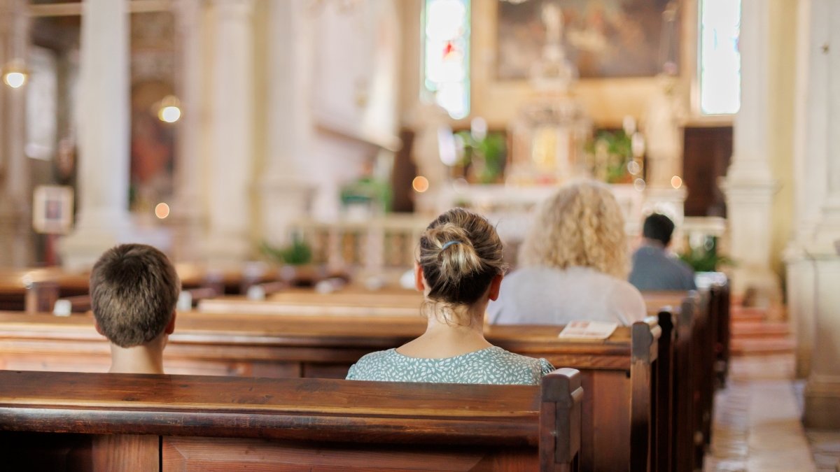Mother and son sitting in a church