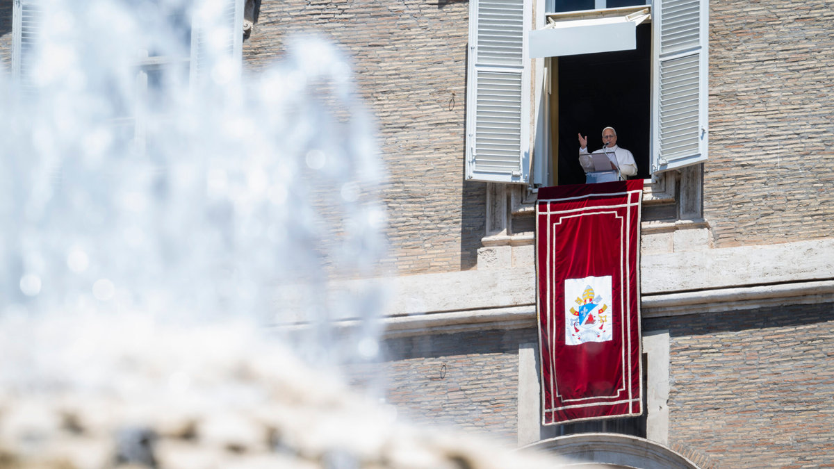 Pope Leo XIV blesses the crowd from a window of the apostolic palace overlooking St Peter's Square during the Angelus prayer in The Vatican on June 21, 2026.