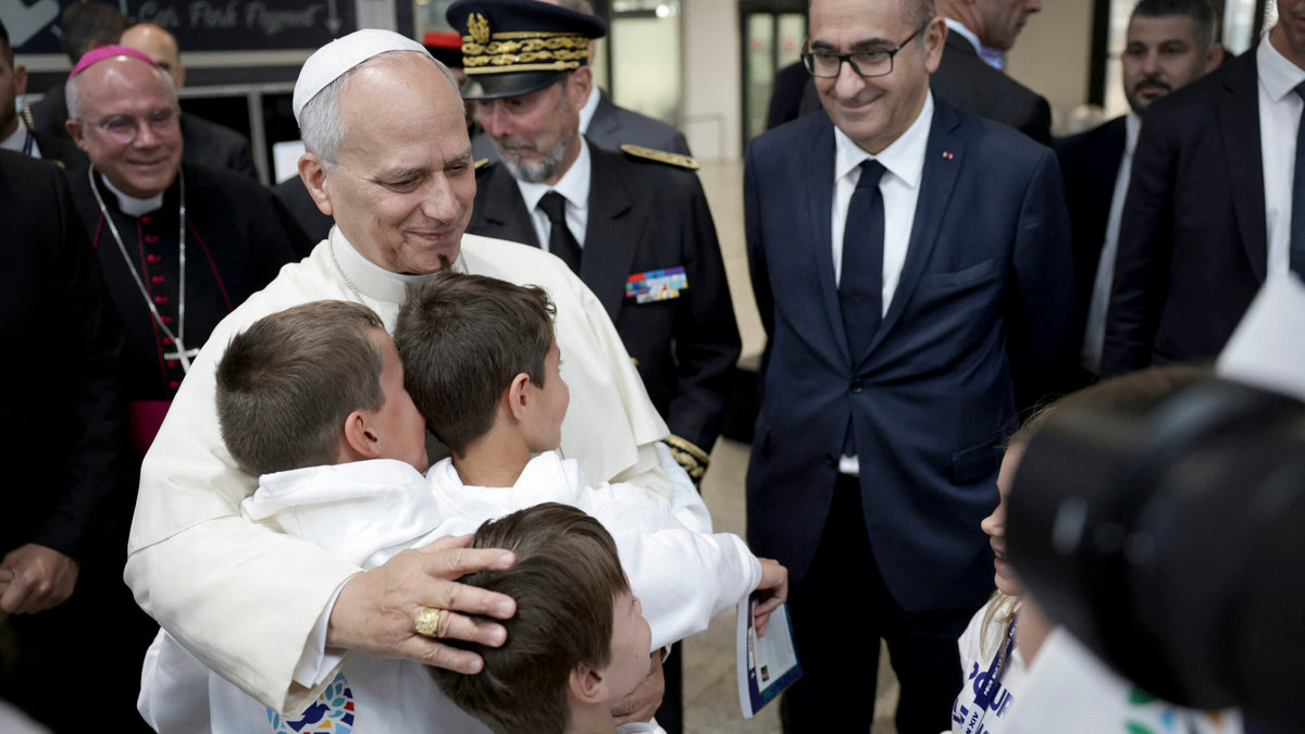 pope-leo-xiv-embraces-children-choir-philippe-ballot-pascal-bolot-laurent-nunez-metz-france-september-28-2026
