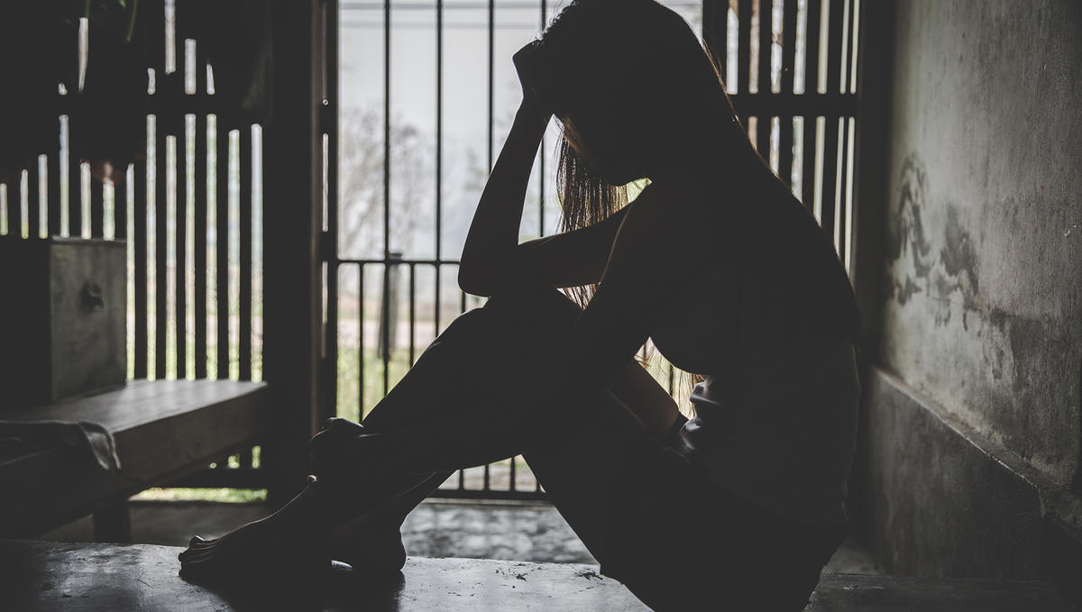 Desperate people are in a dark cell. Human trafficking, Stop abusing violence