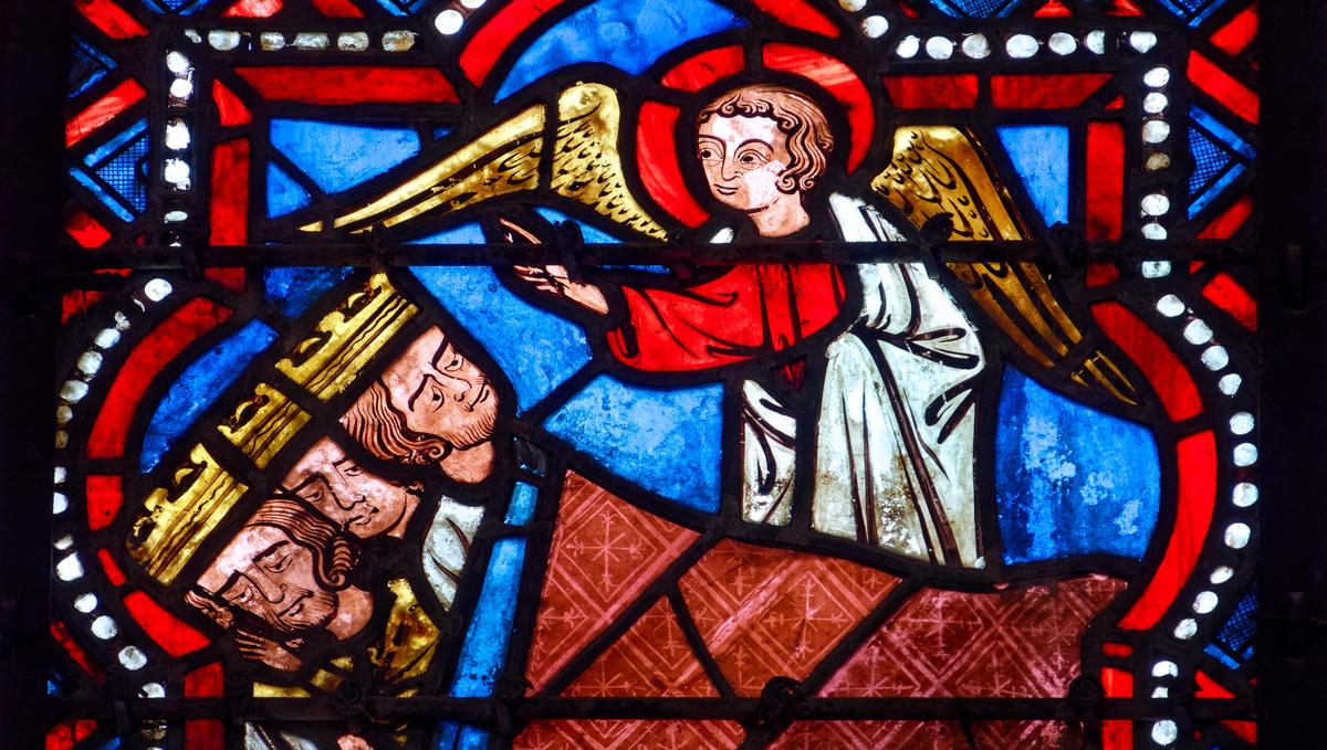 Saint Julien du Sault, FRANCE - 01-28-2025: Stained glass (19th century) of Christmas Nativity Scene : Dream of the Magi on the road to Bethlehem.