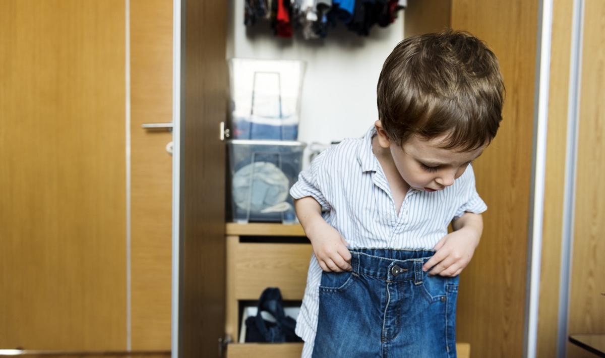 BOY DRESSING UP