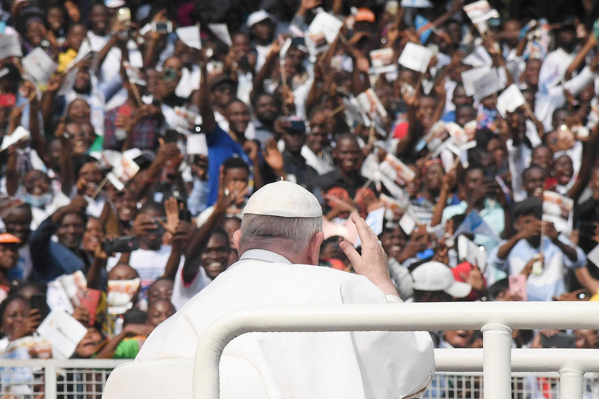 Pope-Francis-waves-as-he-arrives-by-popemobile-for-a-meeting-with-young-people-and-catechists-at-Martyrs-Stadium-in-Kinshasa-AFP
