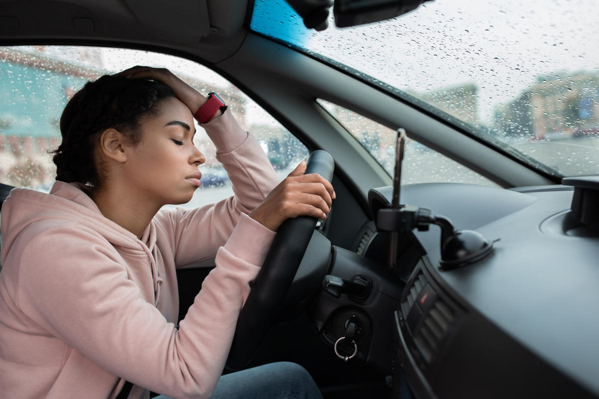 woman distressed car