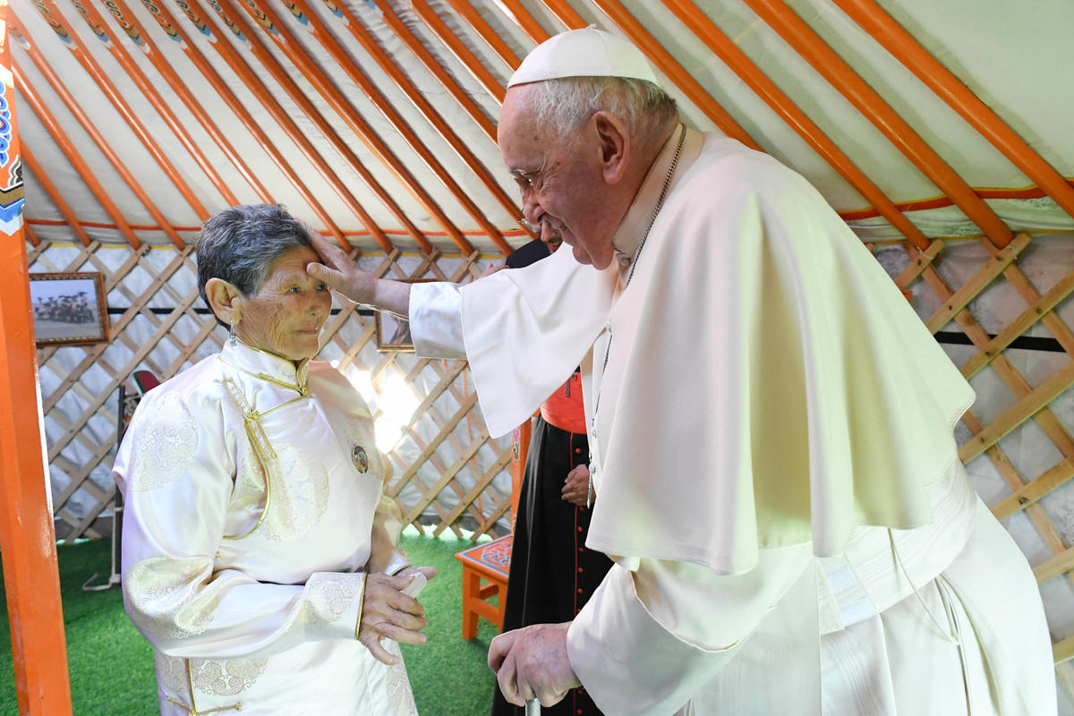 Pope Francis blessing Tsetsege, who some ten years ago had rescued a statuette of the Lady Mother of Heaven from a pile of garbage and later enthroned in the Saints Peter and Paul Cathedral