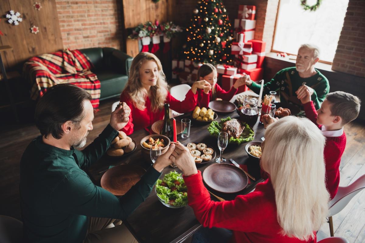 family around table on Christmas