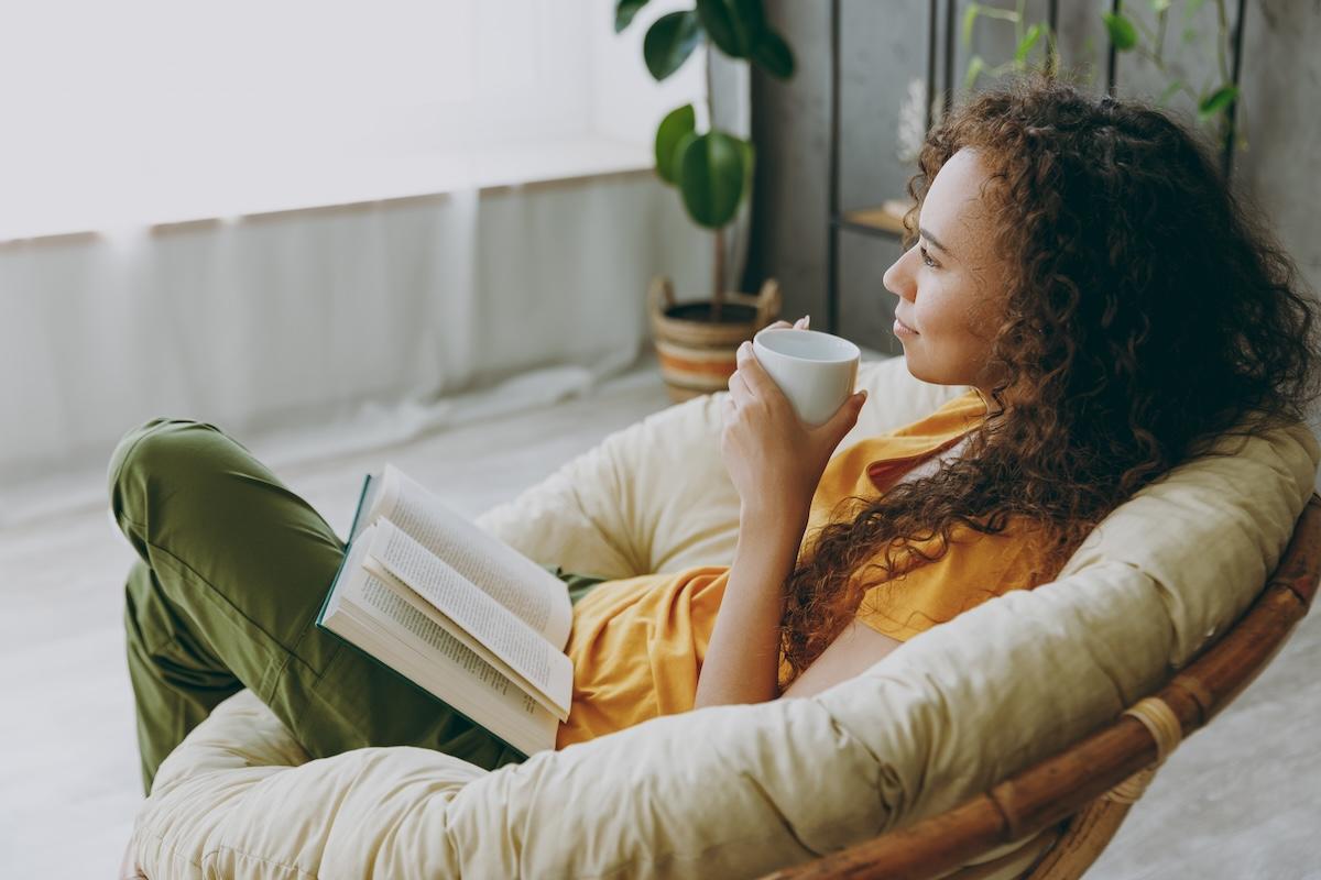 woman tea sun read book plant