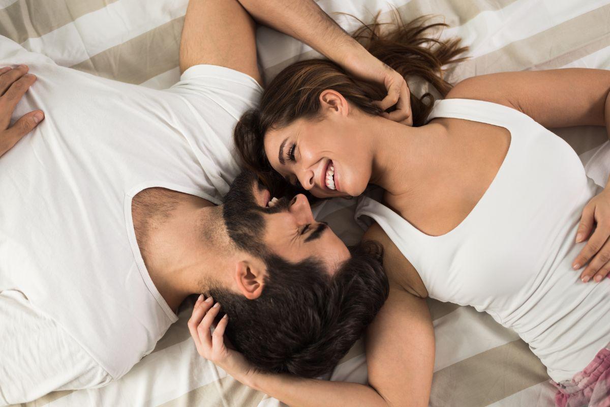 happy couple relaxing in the bedroom