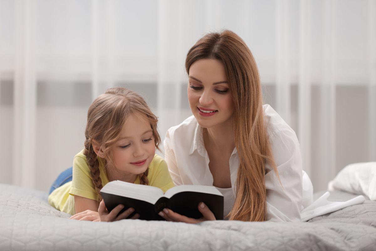 Girl and woman reading the Bible