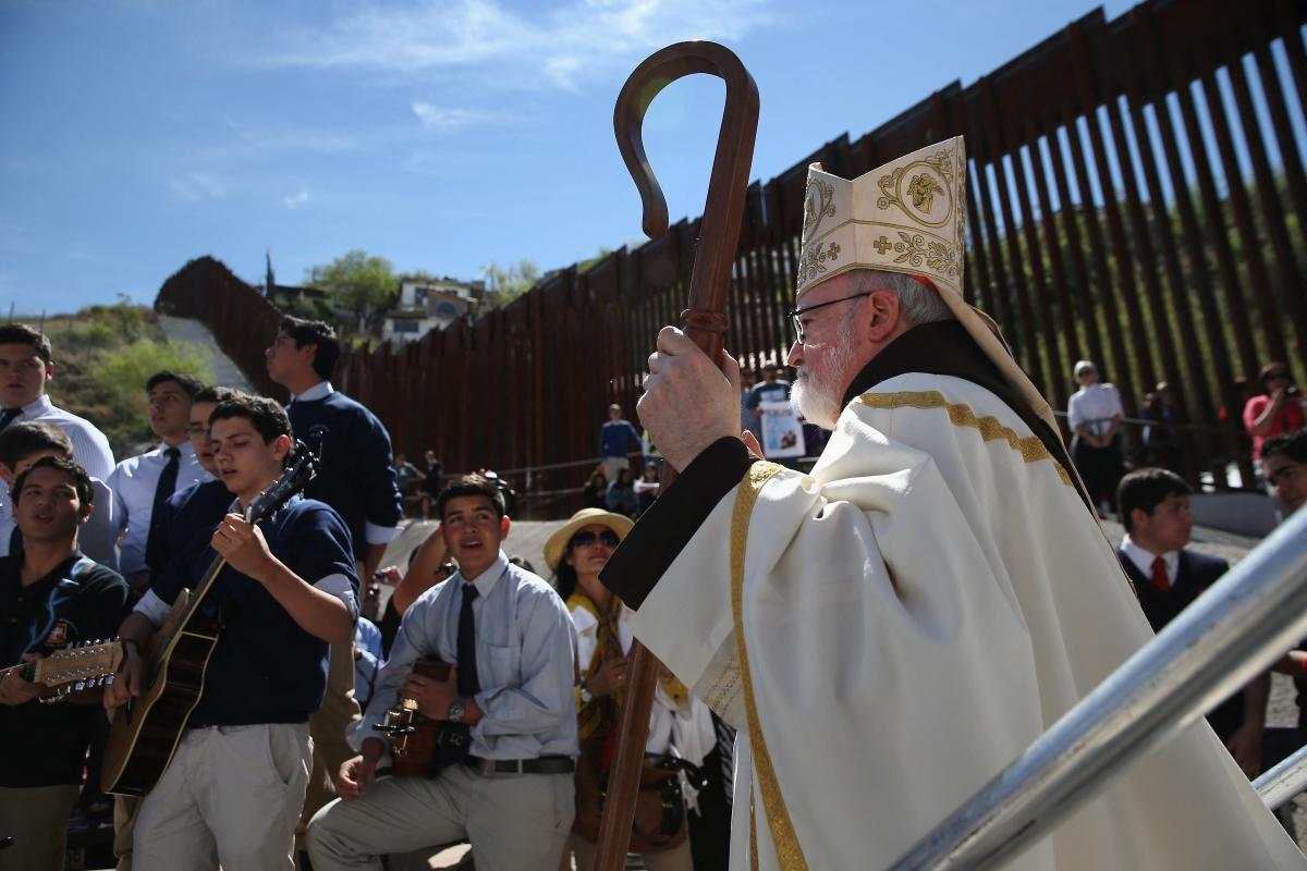 Archbishop of Boston Cardinal Sean O'Malley walks near the U.S.-Mexico border fence following a special 'Mass on the Border' on April 1, 2014 in Nogales, Arizona.