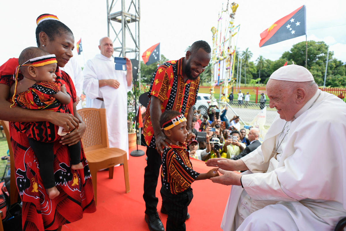 Pope Francis greeting a child during a meeting with Catholic faithful of the diocese of Vanimo in front of Holy Cross Cathedral in Vanimo, Papua New Guinea, on September 8, 2024.