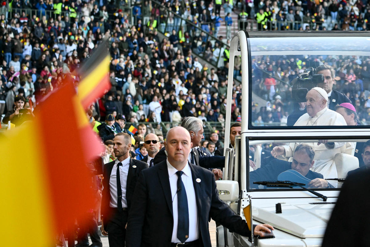 Pope Francis looks on from the popemobile as he arrives at King Badouin Stadium to hold a holy mass, in Brussels on September 29, 2024. The pope is on a four-day apostolic journey to Luxembourg and Belgium.