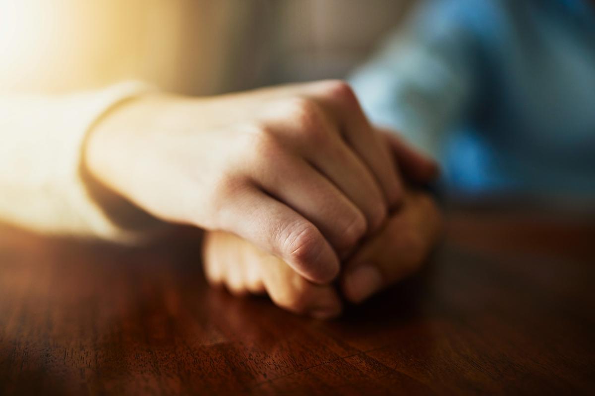 Closeup hands couple praying