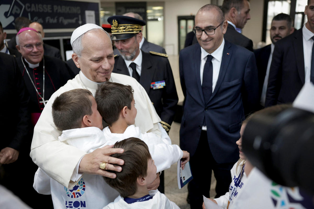 pope-leo-xiv-embraces-children-choir-philippe-ballot-pascal-bolot-laurent-nunez-metz-france-september-28-2026