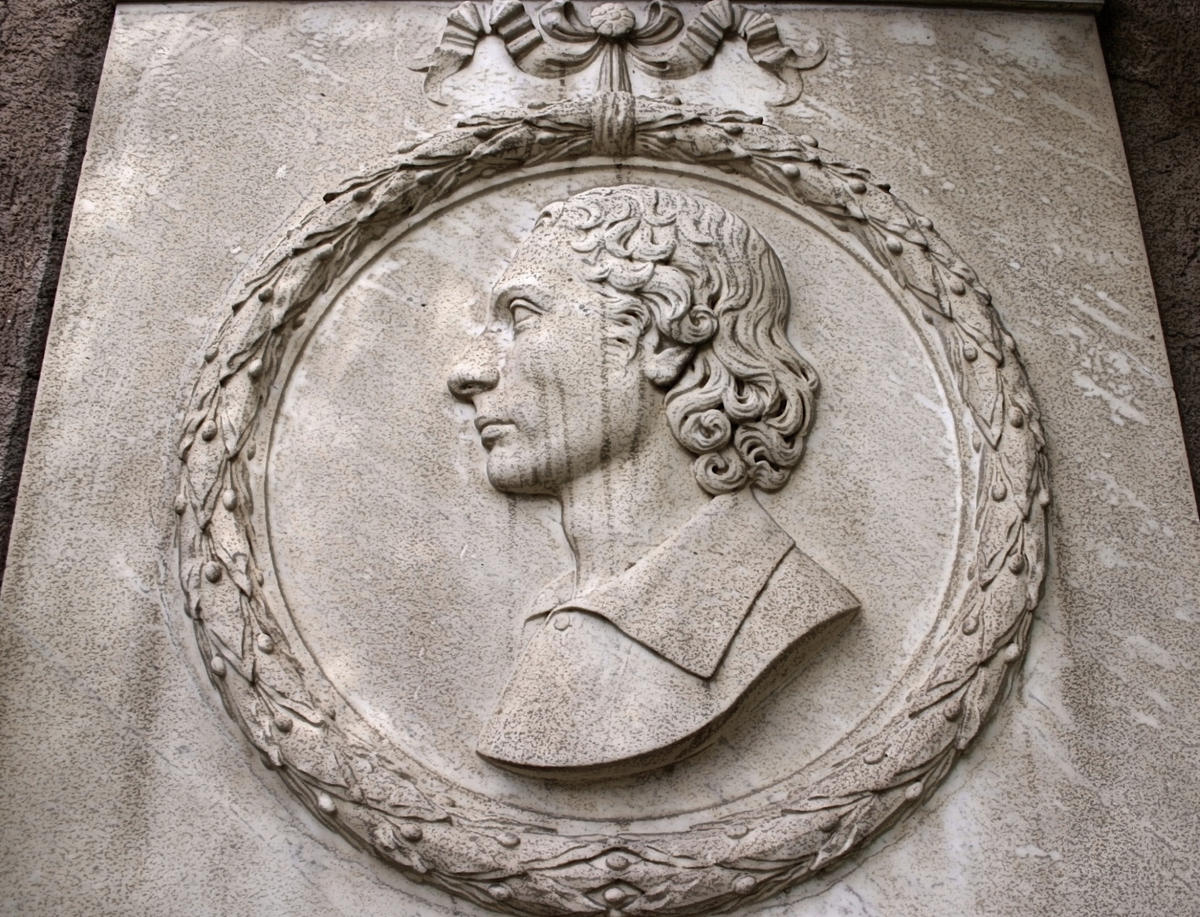Plaque with medallion honoring John Keats near his grave