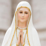 What did Our Lady of Fatima say about the Rosary?