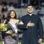 Priest escorts Homecoming Queen — and crowds love it!