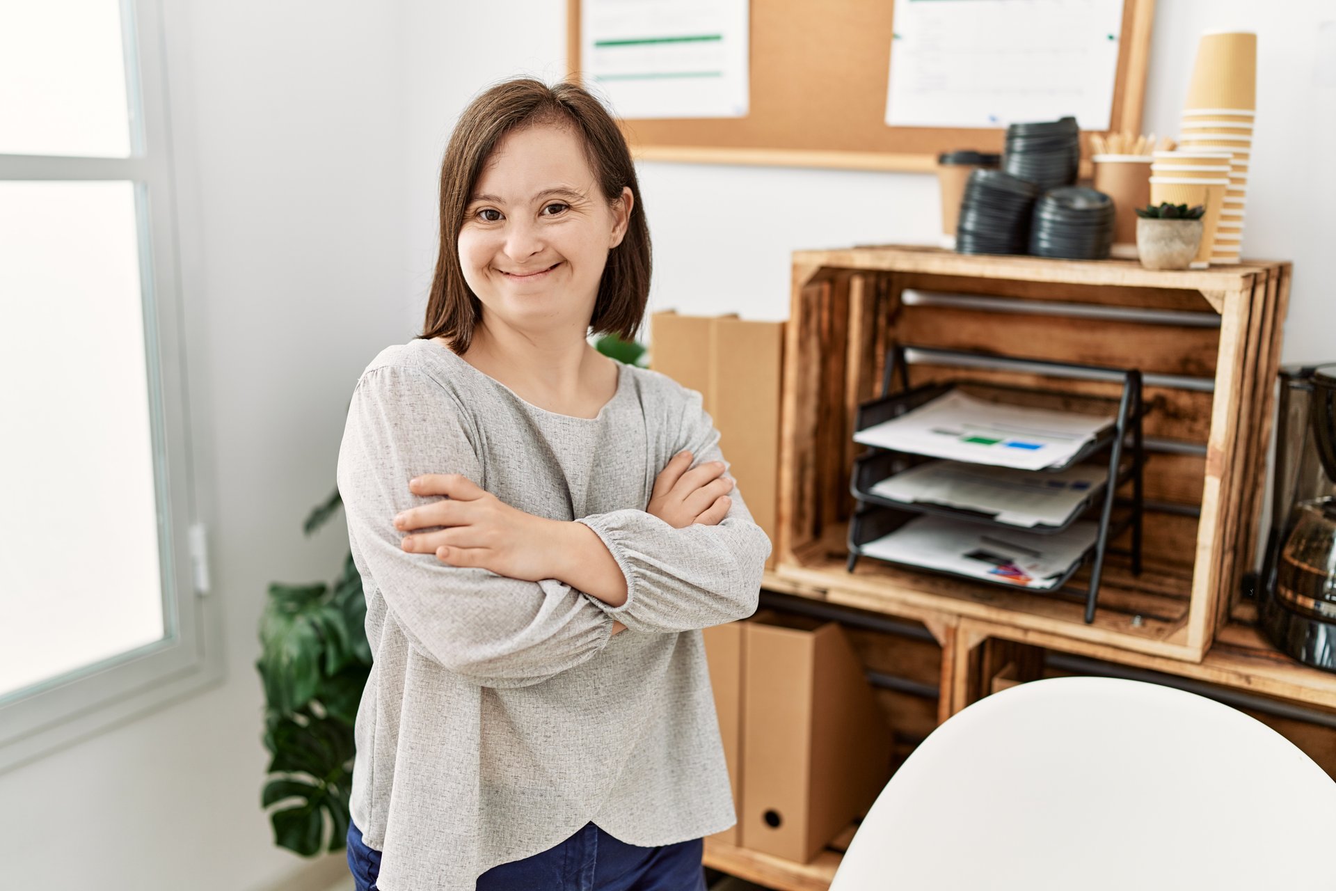 brunette woman with Down syndrome at the office