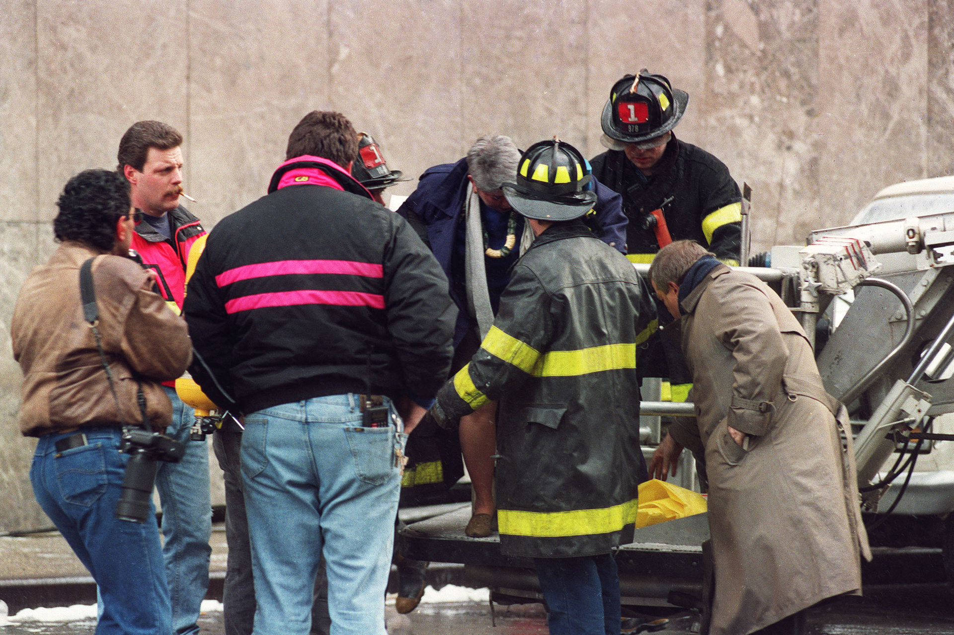 Emergency workers attend person injured in World Trade Center attack