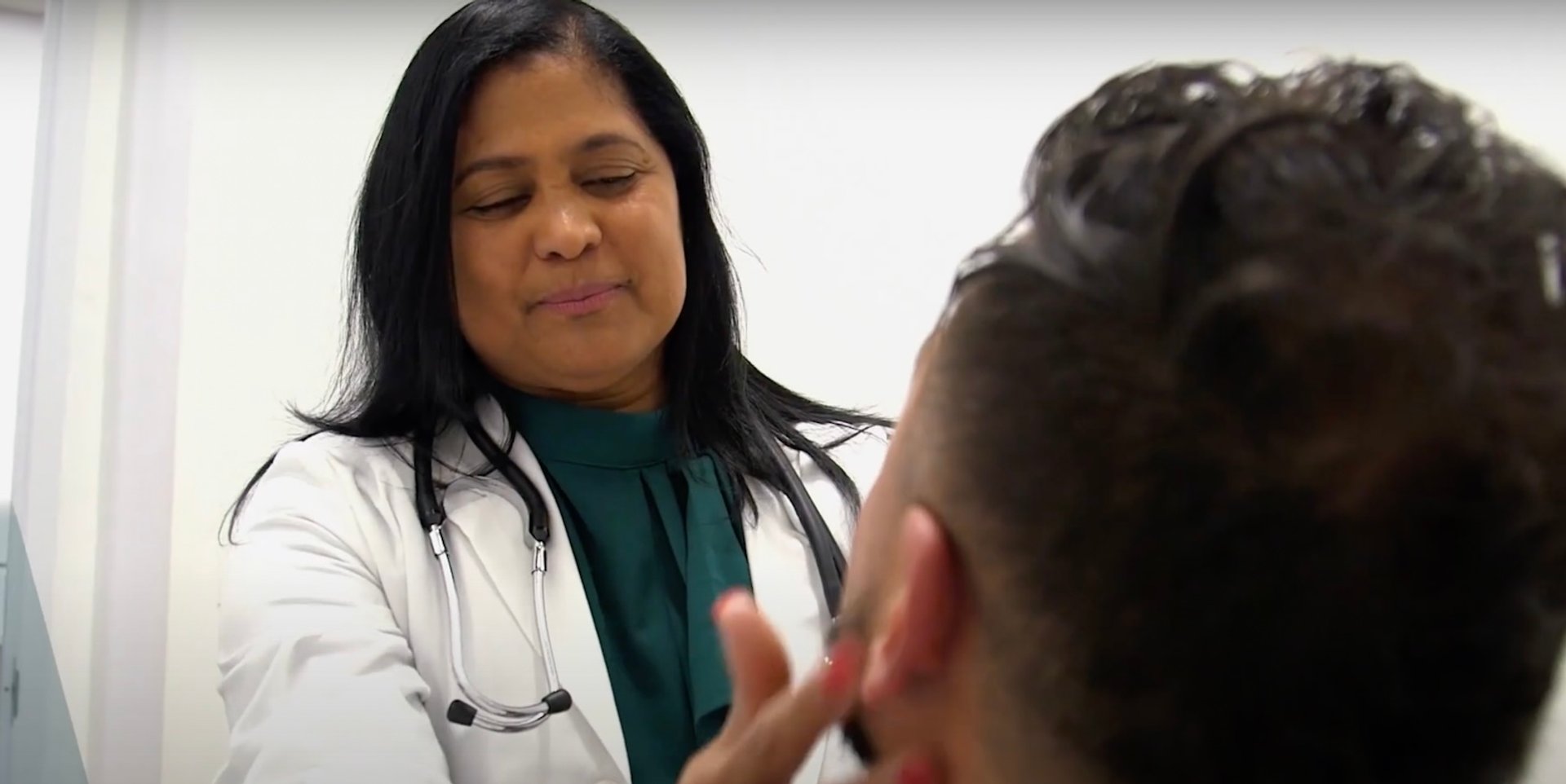 doctor exam woman Latino
